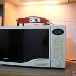 New Furnished 1Br Rajawali Apartment By Travelio