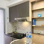 Well Furnished And Homey 2Br Bassura City Apartment By Travelio