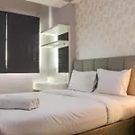 Minimalist And Warm 1Br Signature Park Grande Apartment By Travelio