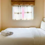 Modern Look And Comfortable 2Br Green Pramuka City Apartment By Travelio