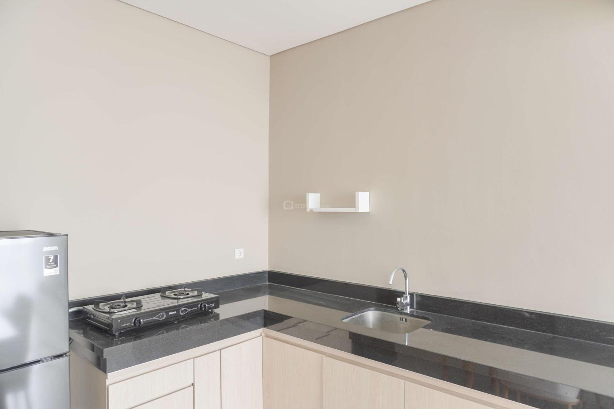 Homey And 2br At Ciputra International By Travelio Apartment