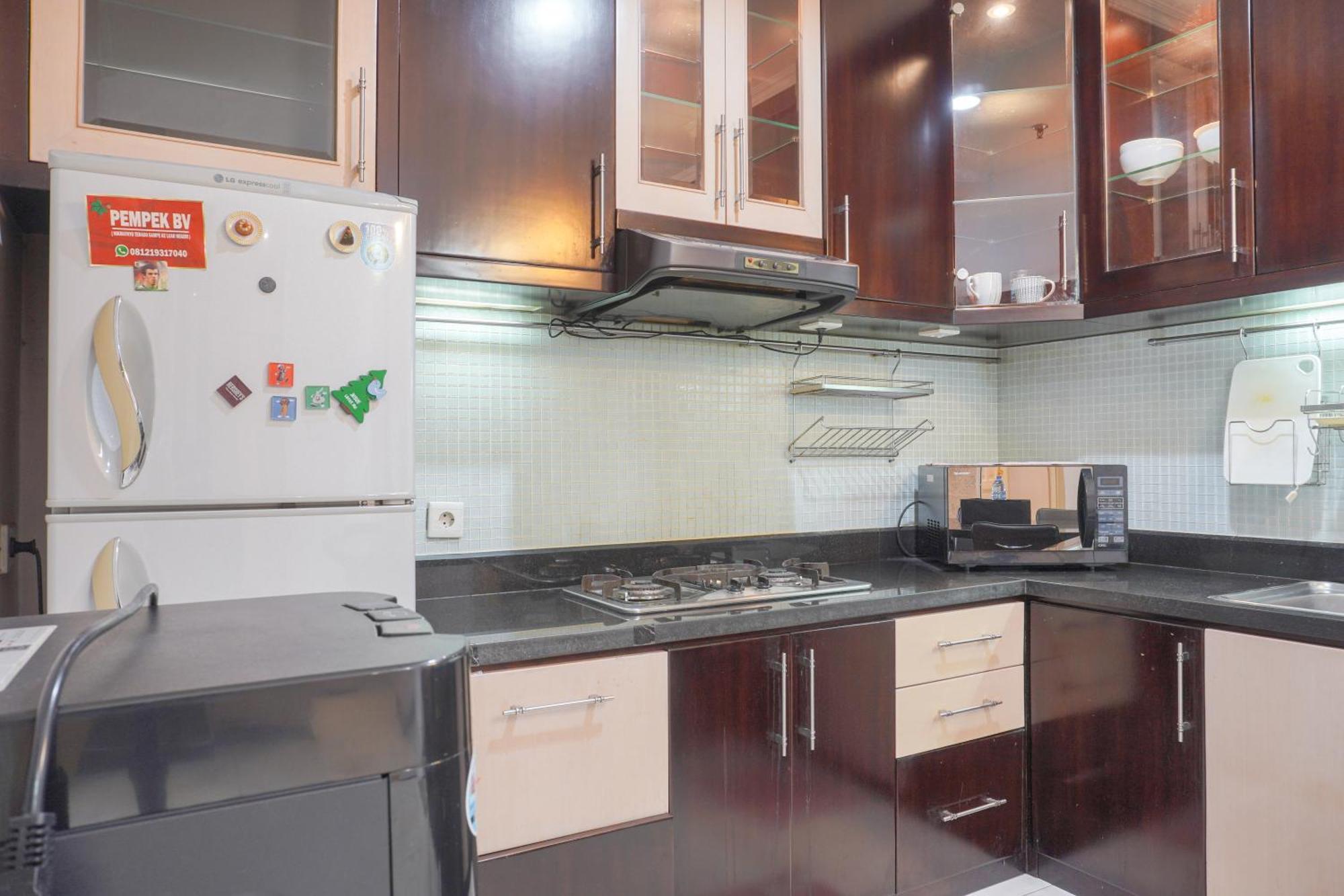 Apartment Cozy And Simply Look 2br At 12nd Floor Puri Garden By Travelio *
