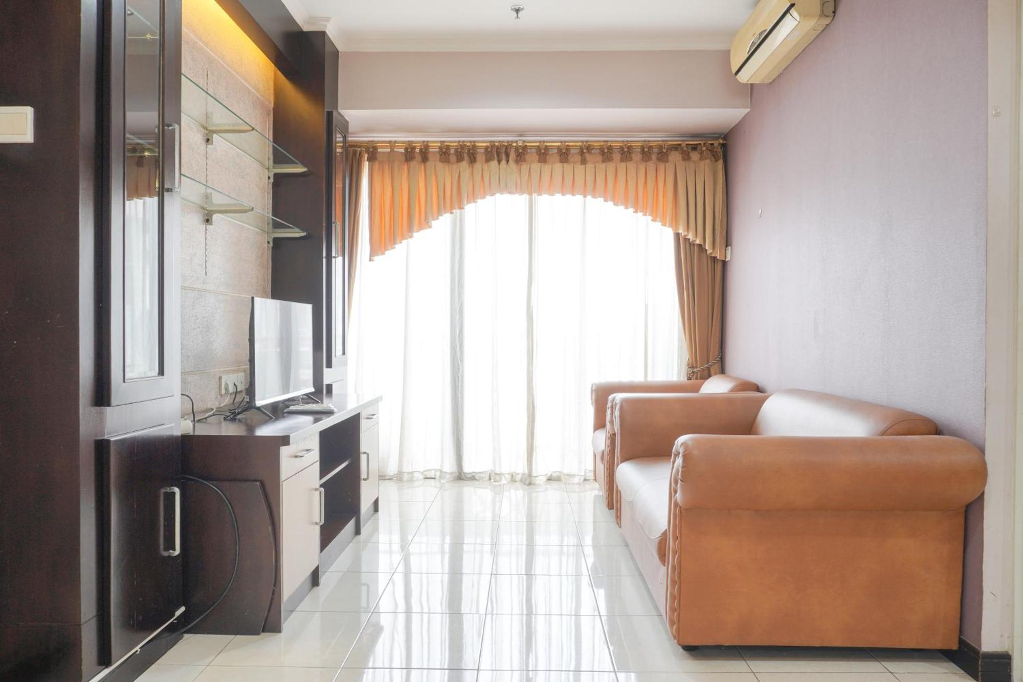 Cozy And Simply Look 2br At 12nd Floor Puri Garden By Travelio Apartment *