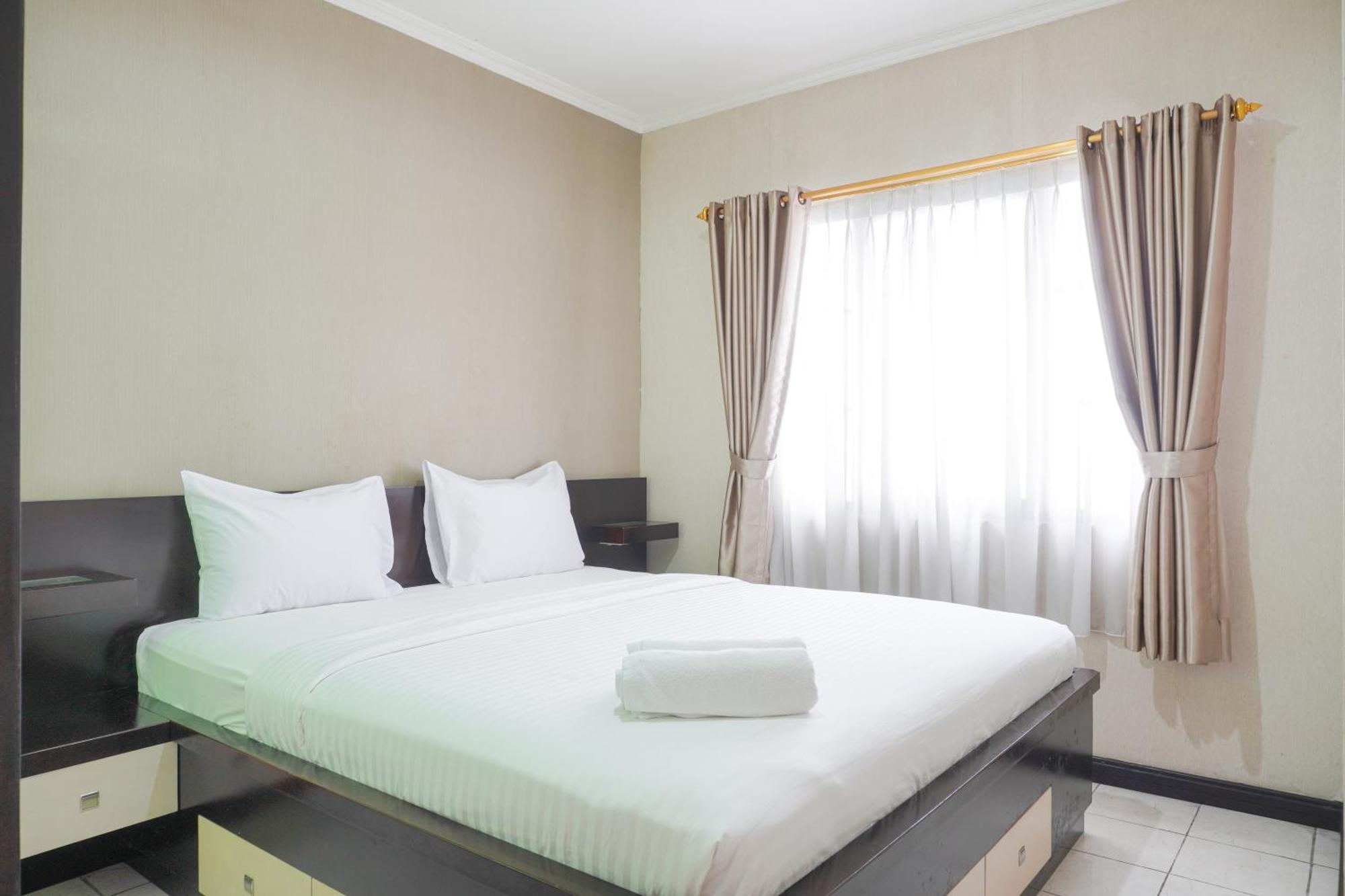 Cozy And Simply Look 2br At 12nd Floor Puri Garden By Travelio Apartment