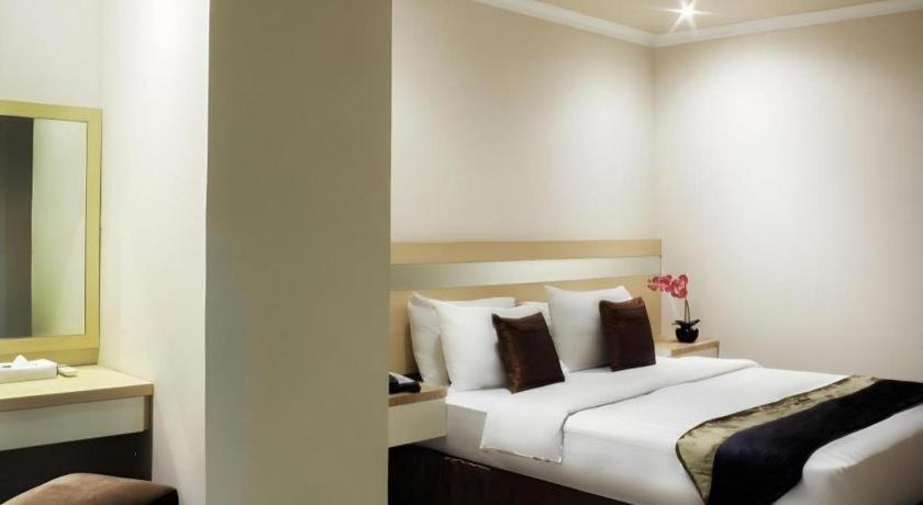 Amos Cozy Melawai Hotel