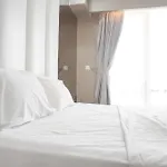 Minimalist And Cozy Studio At Ambassade Kuningan Apartment By Travelio