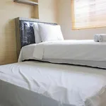Minimalist 2Br Green Pramuka City Apartment Near Shopping Mall By Travelio