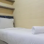 Minimalist 2Br Green Pramuka City Apartment Near Shopping Mall By Travelio
