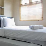 Minimalist 2Br Green Pramuka City Apartment Near Shopping Mall By Travelio