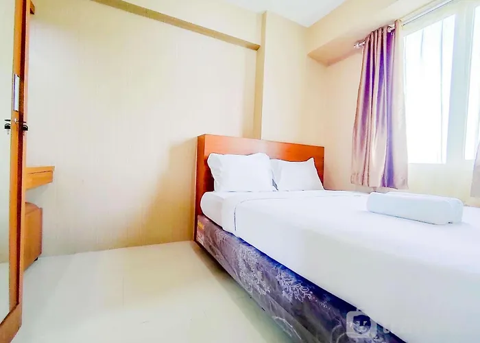 Homey And Cozy Living 2Br At Bassura City Apartment By Travelio