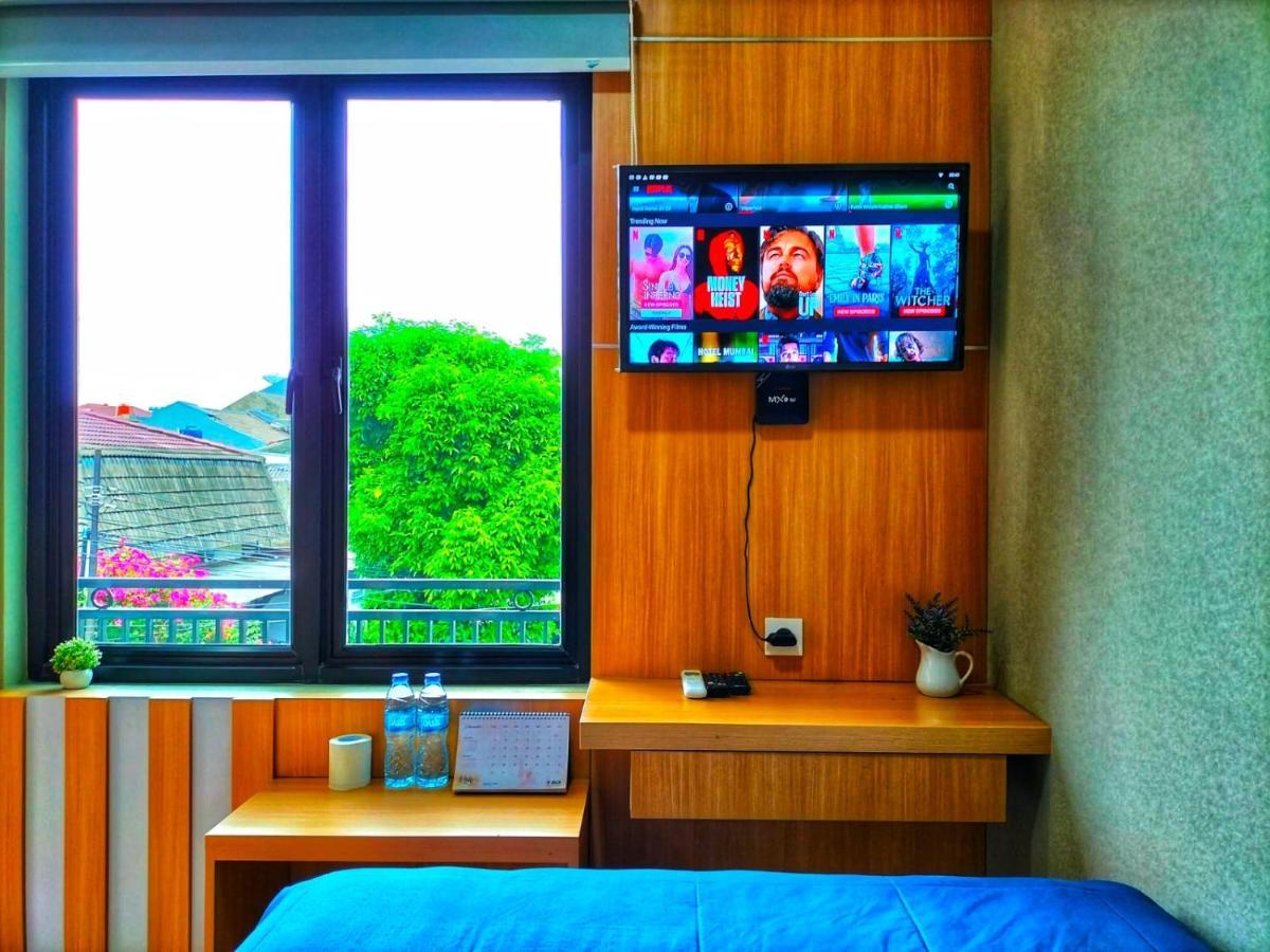Cozy Tomang Hotel *